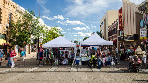 Sheridan's 3rd Thursday Street Festival bustling with community members exploring vendor booths under a sunny sky.